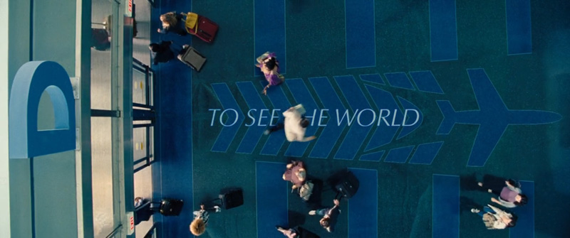 To See The World written on the floor of an airport